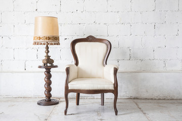 vintage armchair on white wall.