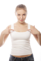  woman in blank white t-shirt showing at herself