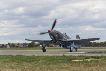 Fototapeta na wymiar World War II Soviet fighter Yakovlev Yak-3 on runway