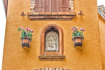 Catholic icon in alleys of the medieval village