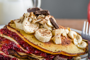 Homemade pancakes with currant jam