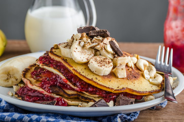Homemade pancakes with currant jam