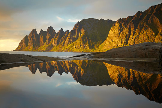 Peaks of the Okshornan mountain in sunset lights. Senja, Norway
