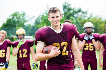 American Football player showing trick with ball