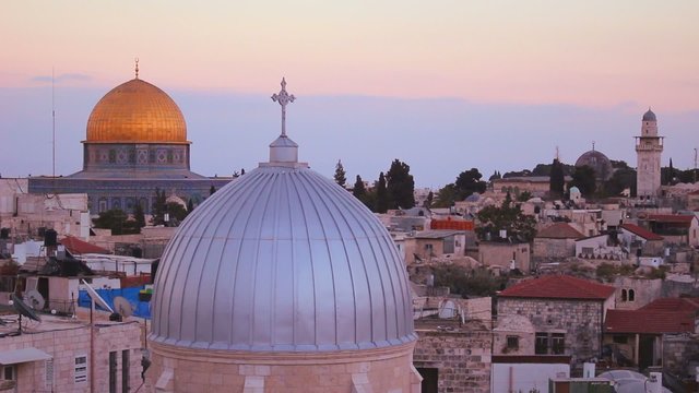 The Dome of the Rock is framed with Christian churches and mosques over the skyline of the Old City of Jerusalem.