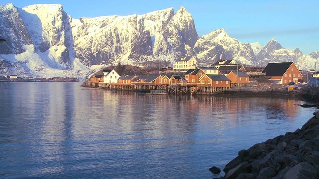 Fishing huts stand in rows in a village in the Arctic Lofoten Islands, Norway.
