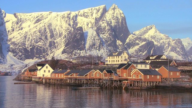 Fishing huts stand in rows in a village in the Arctic Lofoten Islands, Norway.