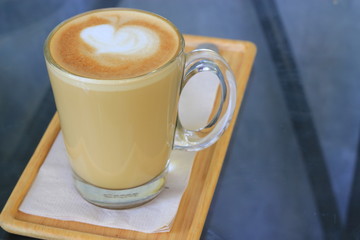 cup of cappuccino with foam in the form of heart