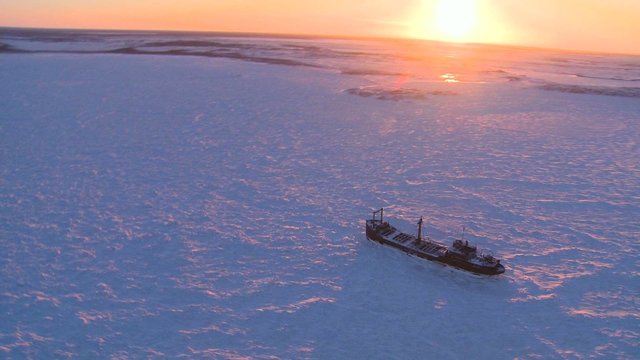 Beautiful aerial of a ship trapped in the ice of frozen Hudson Bay, Churchill, Manitoba, Canada.