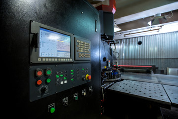 Punching machine. Foreground of control panel