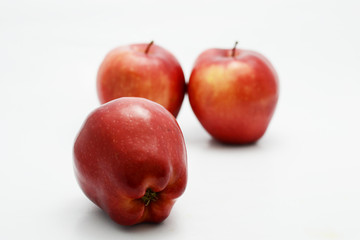 red apple on white ground