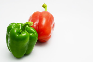 red and green bell pepper on white background
