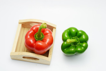 red and green bell pepper on white background