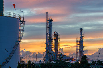 Oil refinery at twilight sky, close up to pipe line