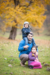 Fototapeta premium father with children in autumn mountains