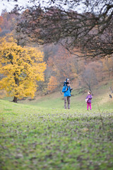 father with children in the mountains