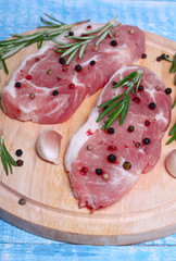 fresh raw meat with rosemary and pepper