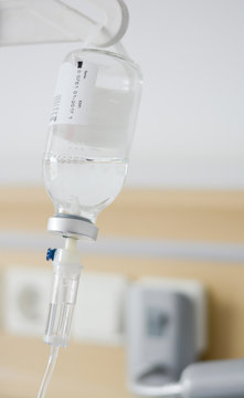 Intravenous drip or perfusion recipient administrated in a hospital room