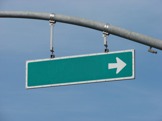 Green sign with white arrow