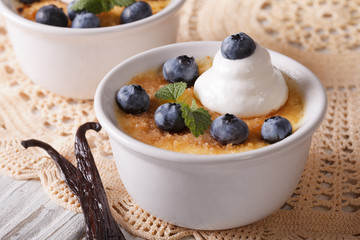 Creme brulee decorated with blueberry close-up. horizontal
