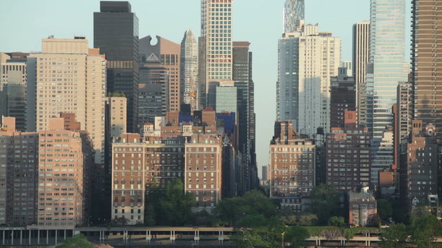 Closeup of skyscrapers and morning scene of FDR drive and East 57th Street in Midtown Manhattan, New York City, USA.