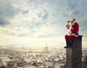 Santa Claus looking through a binoculars