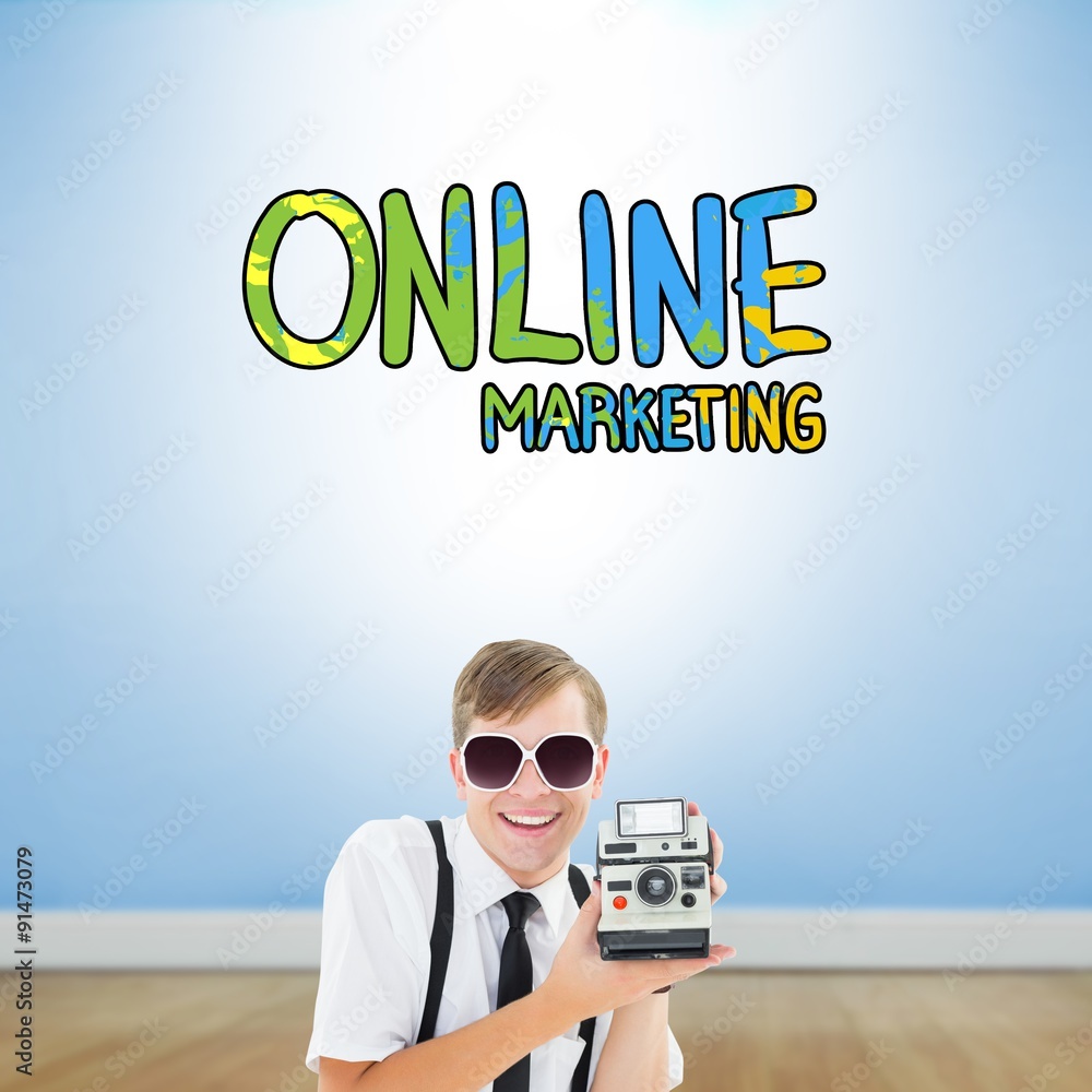 Poster composite image of geeky hipster holding a retro camera