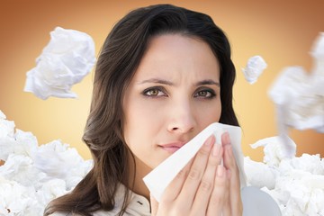 Composite image of brunette with a cold