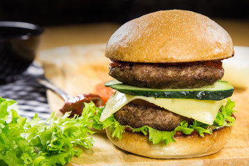 Beef burger with cheese and vegetables