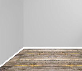 empty room corner with wooden floor and grey wall