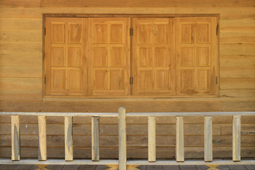 Fototapeta na wymiar Beautiful terrace and window made from take wood.