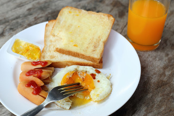Set of american breakfast on wooden table.