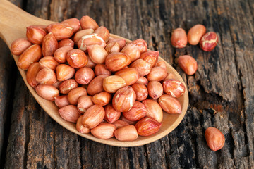 Peanuts on wooden table.