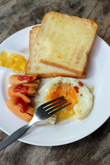 Set of american breakfast on wooden table.