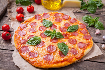 Traditional homemade pepperoni pizza with salami garlic tomato