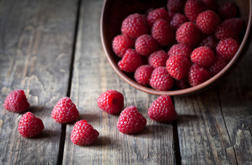 Raspberries fresh organic vegetarian dessert snack in clay dish