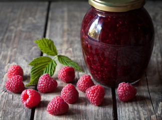 Homemade raspberry jam in glass mason jar. Healthy delicious