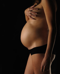 pregnant woman with black background