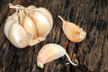Garlic on old wooden background