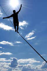 Man balancing on the rope concept of risk taking