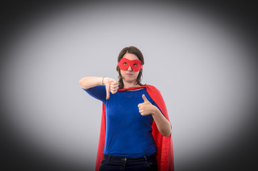 Woman superhero with red cape