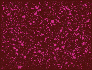 graffiti paint splatter pattern in pink over deep red