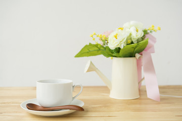 cup of tea with flower on wood table