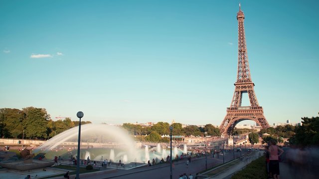 Eiffel Tower With Gardens Of The Trocadero, Evening, Paris: A timelapse of the gardens of the Trocadero with the Eiffel Tower in the background by a sunny evening.