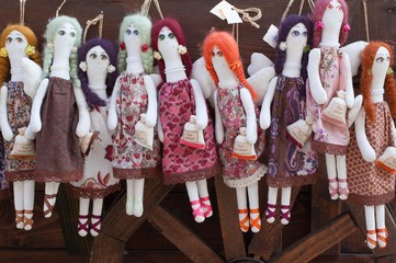 Colorful puppets hanging in the shop