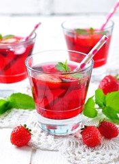 homemade strawberry compote with fresh berries, mint and ice cubes