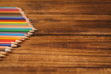 Obraz premium Colour pencils on desk with copy space