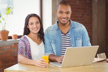 Portrait of smiling business people working in office