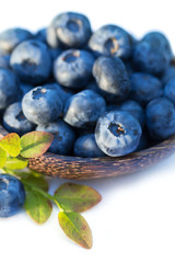 Fresh sweet tasty blueberries on white background