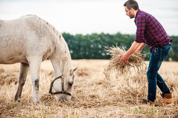Taking care of his favorite horse. 